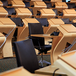 Empty chairs in the Debating Chamber