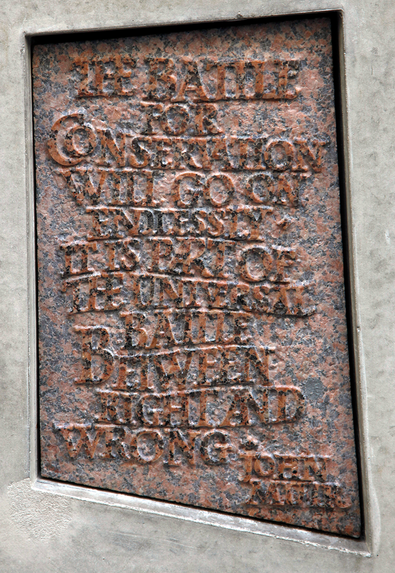 Stone with the following words carved on it: "The battle for conservation will go on endlessly. It is part of the universal battle between right and wrong. John Muir"