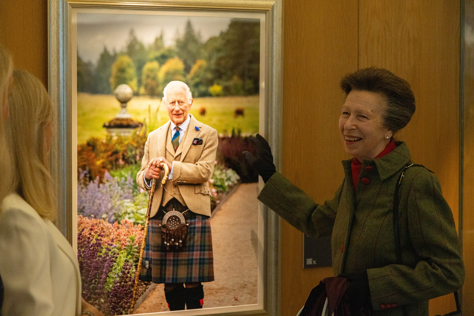 Her Royal Highness The Princess Royal unveils a photographic portrait of His Majesty The King at the Scottish Parliament.